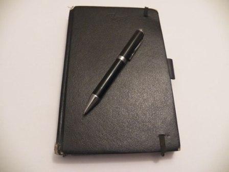 Success journal with pen for making entries