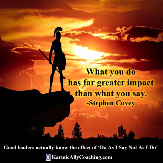 Spartan standing on cliff at sunrise with Stephen Covey leadership quote