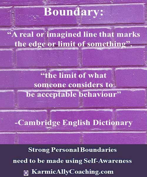 Purple wall with 2 definitions of boundary from Cambridge English Dictionary