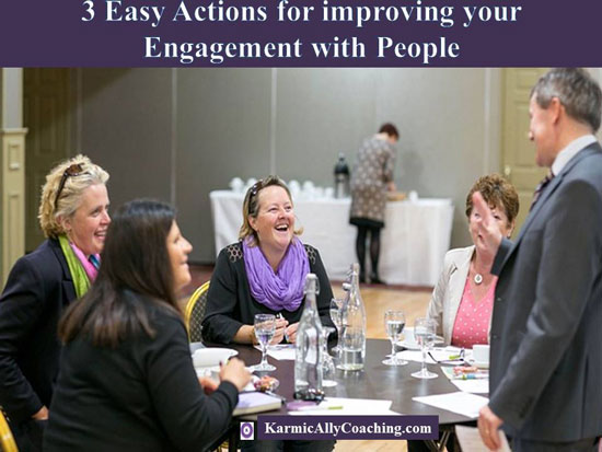 Man engaging with a group of women paying attention to one person in specific