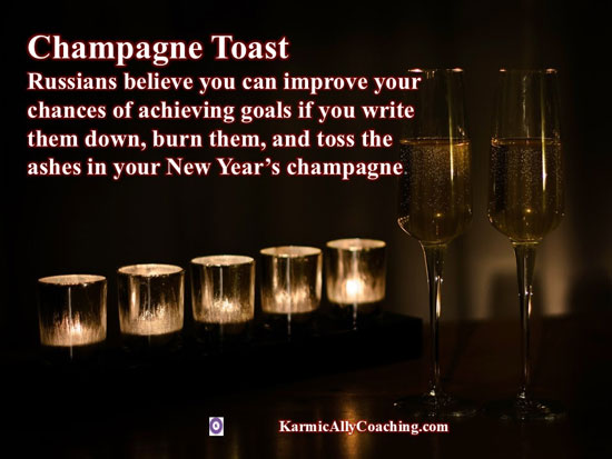 Champagne glasses with lit paper as a New Year Ritual